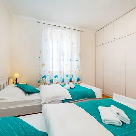 Caesar By Belmont Realty *