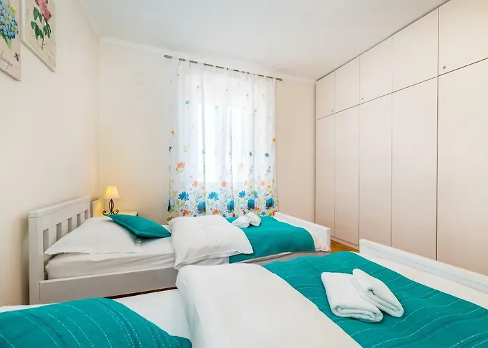 Caesar By Belmont Realty *